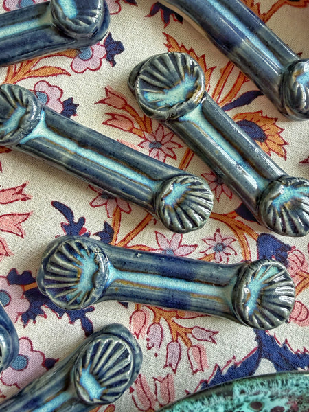 8 porte couteaux coquilles